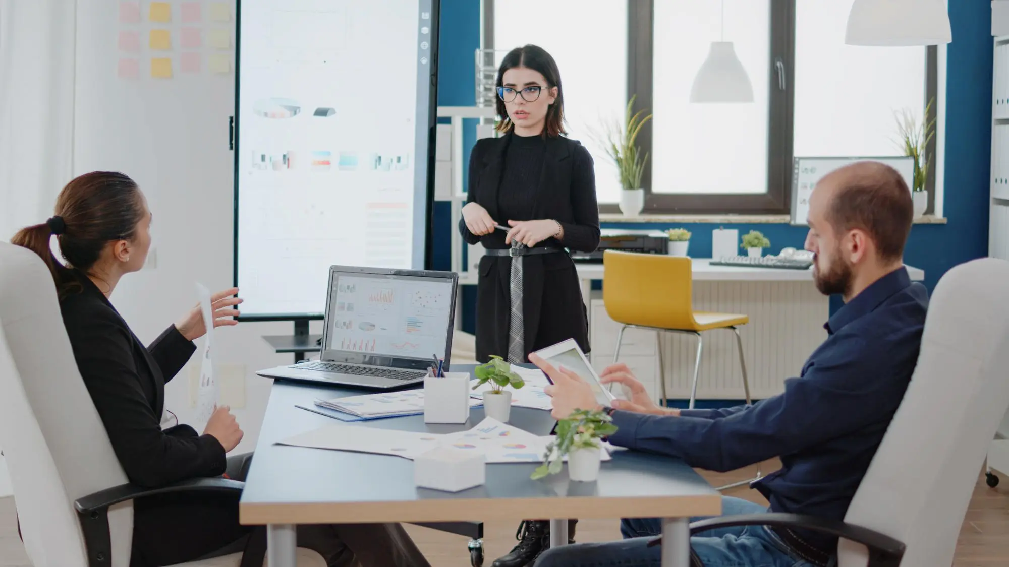 small team reviewing a monthly content schedule together