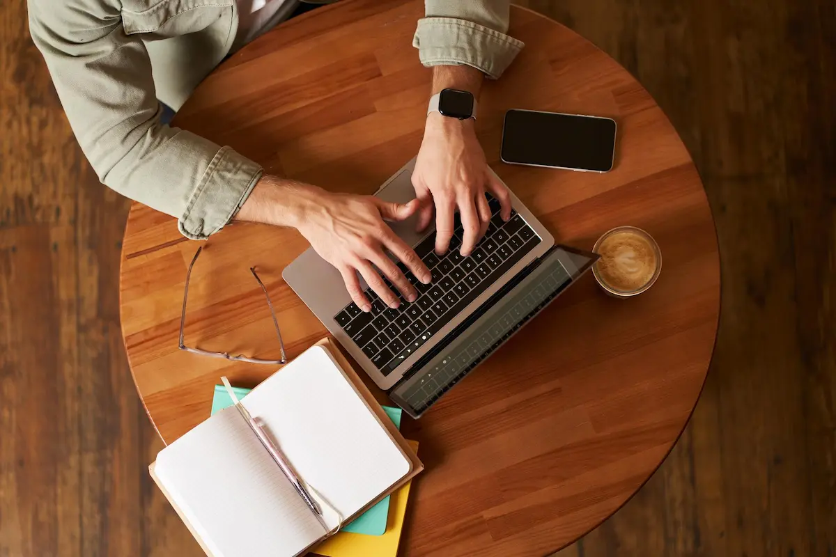 person writing page titles on a laptop